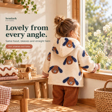 Back view of a child wearing the cream dog-print sherpa and rust gingham hooded jacket. The hood, shoulders, long sleeves and straight hem are visible.