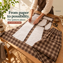 Cutting/preparation story showing rich cocoa-brown and warm cream windowpane plaid wide-leg pants with elastic waist and front pockets. Hemlark digital sewing pattern.